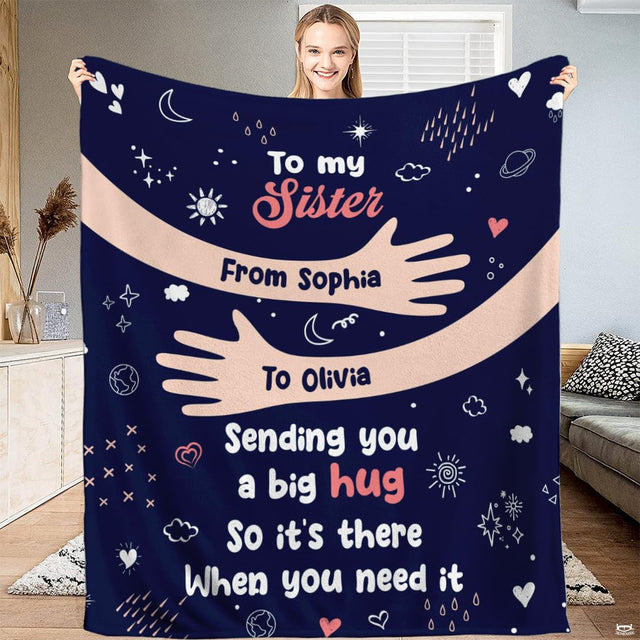 Embracing arms with celestial doodle stars and hearts on navy throw blanket