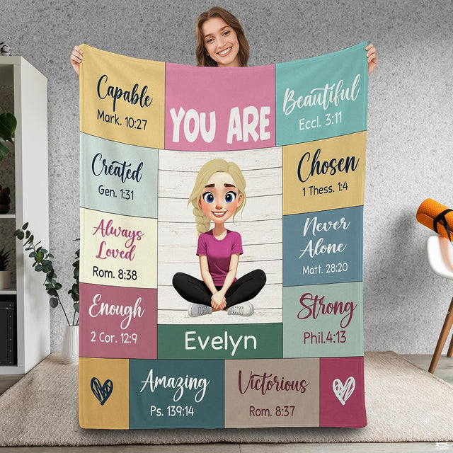 Bedding displaying pastel patchwork art with scripture citations and a central blonde girl illustration.