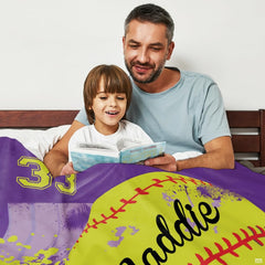 Living room setting featuring purple softball throw blanket draped across home sofa seating