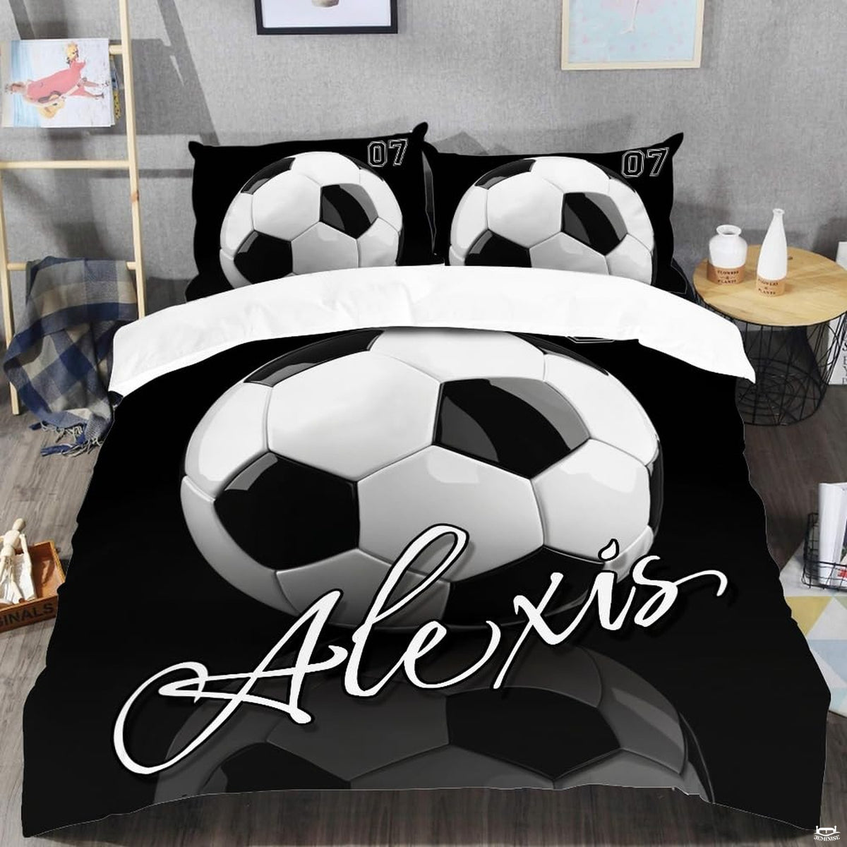 Top-down view of monochrome black and white football bedding set arranged neatly on a youth bedroom mattress