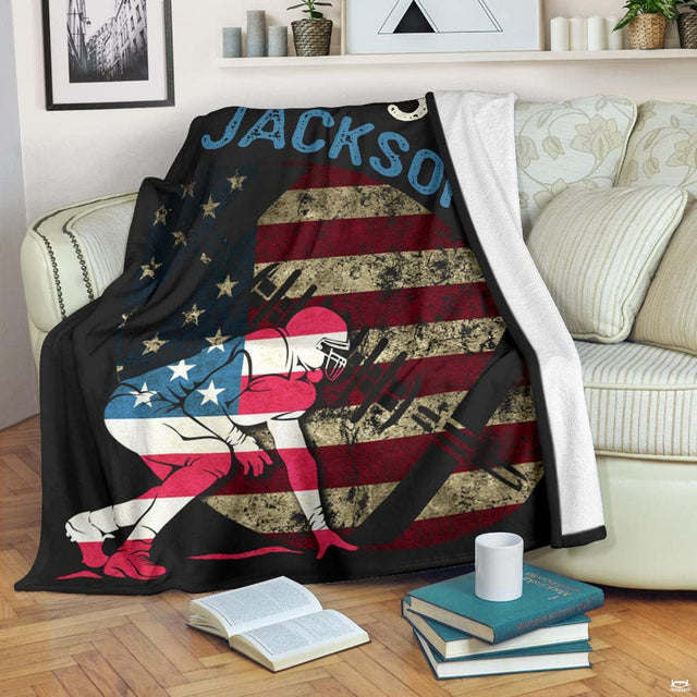 Close view of lineman stance and distressed flag emblem on blanket