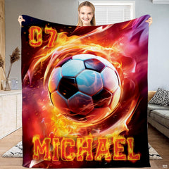 Fiery soccer ball bedding set showing blazing orange and red flames on a dark background.