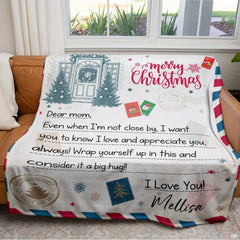 Holiday living room couch displaying the Christmas letter to mom throw blanket
