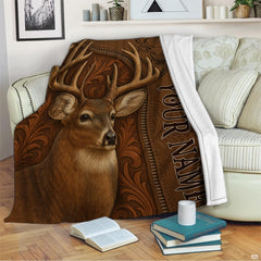 Close-up view of deer antler rack, lifelike eyes, and western leaf tooling details.