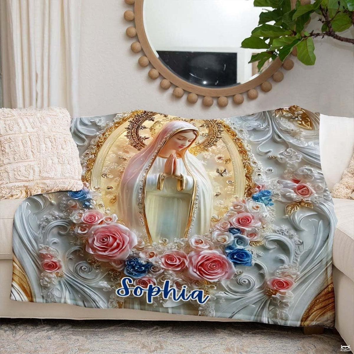 Our Lady of Fatima cameo blanket styled neatly across an ivory living room couch.