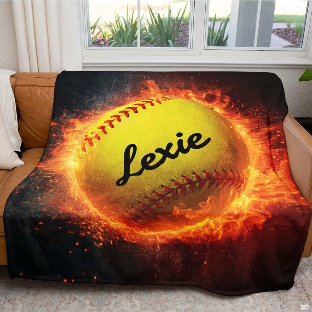 Close view of vibrant optic yellow softball surrounded by flame details