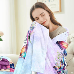 Christian cross butterflies floral blanket in styled nursery setting