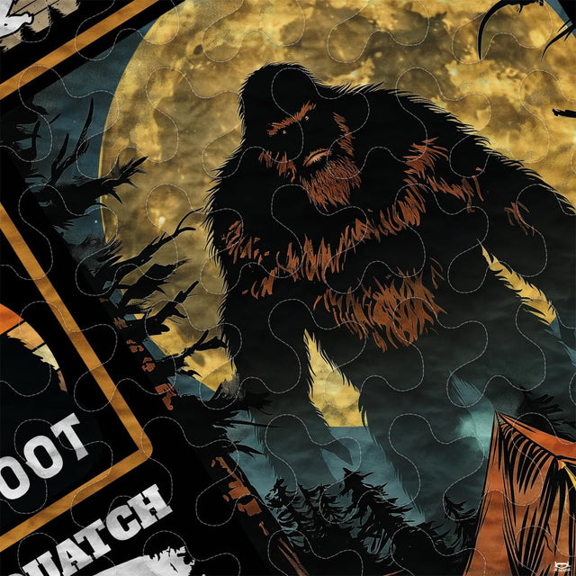 Close-up of retro outdoor adventure emblems and nocturnal wilderness graphics on a themed bedding set