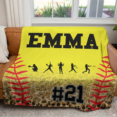 Fastpitch cheetah print graphic blanket arranged over living room armchair