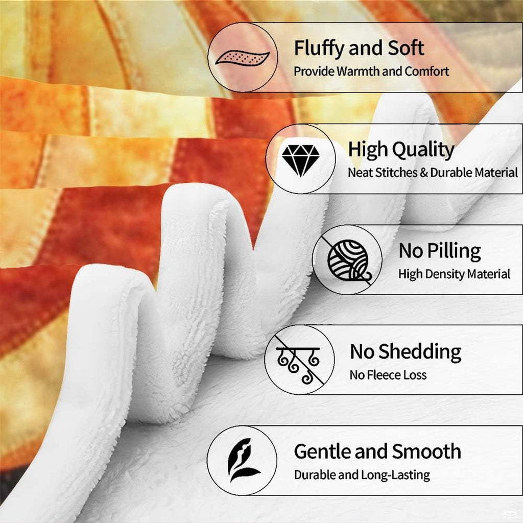 Overhead flat view of autumn quilted patchwork pumpkin throw blanket