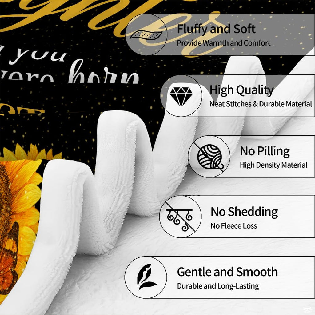 Flat overhead view displaying full golden cross and sunflower tribute design on a throw blanket
