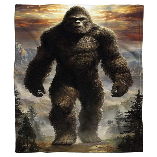 Muscular Bigfoot Sasquatch walking along mountain ridge beneath golden sunset, view 2.