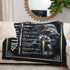 Heroic lion and knight graphic blanket draped over living room sofa