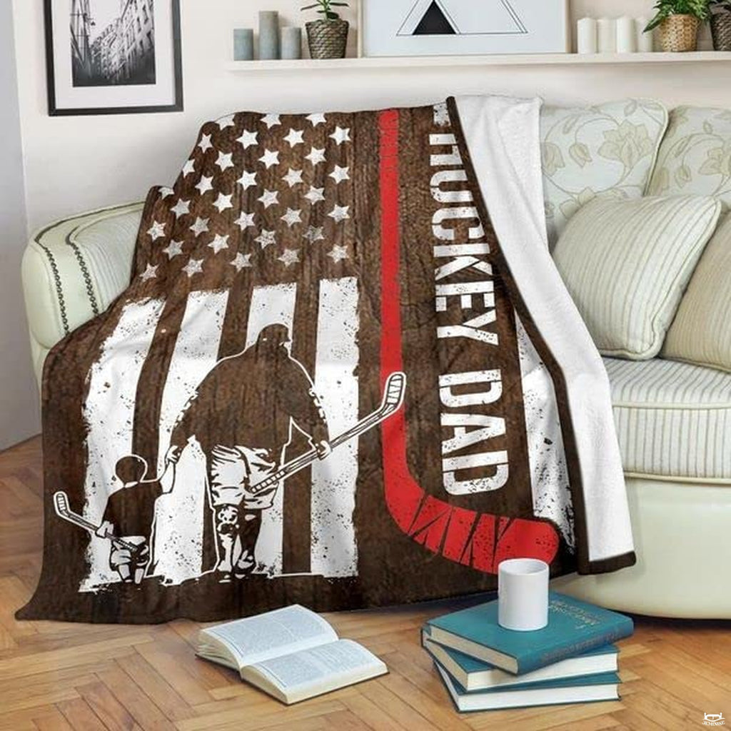 Patriotic timber flag graphic with skater father and son silhouettes draped over living room armchair.