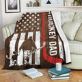 Patriotic timber flag graphic with skater father and son silhouettes draped over living room armchair.