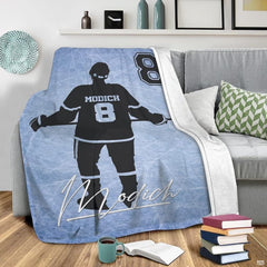 Hockey bedding set styled in a bright bedroom with athletic winter sports wall art