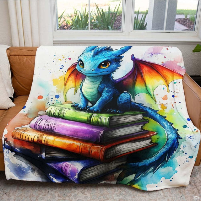 Living room sofa displaying the colorful watercolor baby dragon book throw blanket.
