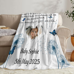 Lifestyle setting displaying the butterfly throw blanket neatly folded on an armchair.