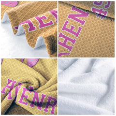 Detailed view of pink dripping glaze and baseball batter silhouette on golden cone-textured bedding set.
