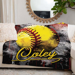 Fastpitch softball blanket displayed on cream couch in front of round mirror