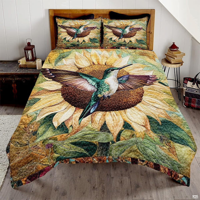 Teal and white hummingbird over a large cream sunflower design
