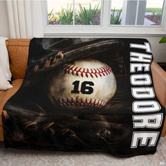 Baseball resting inside a dark fielder glove beside vertical white varsity lettering, view 5.