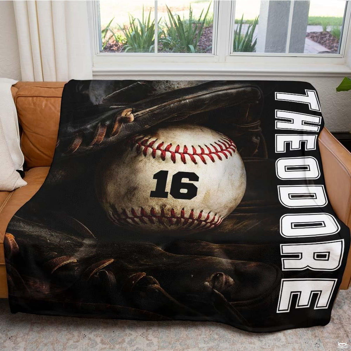 Baseball resting inside a dark fielder glove beside vertical white varsity lettering, view 5.