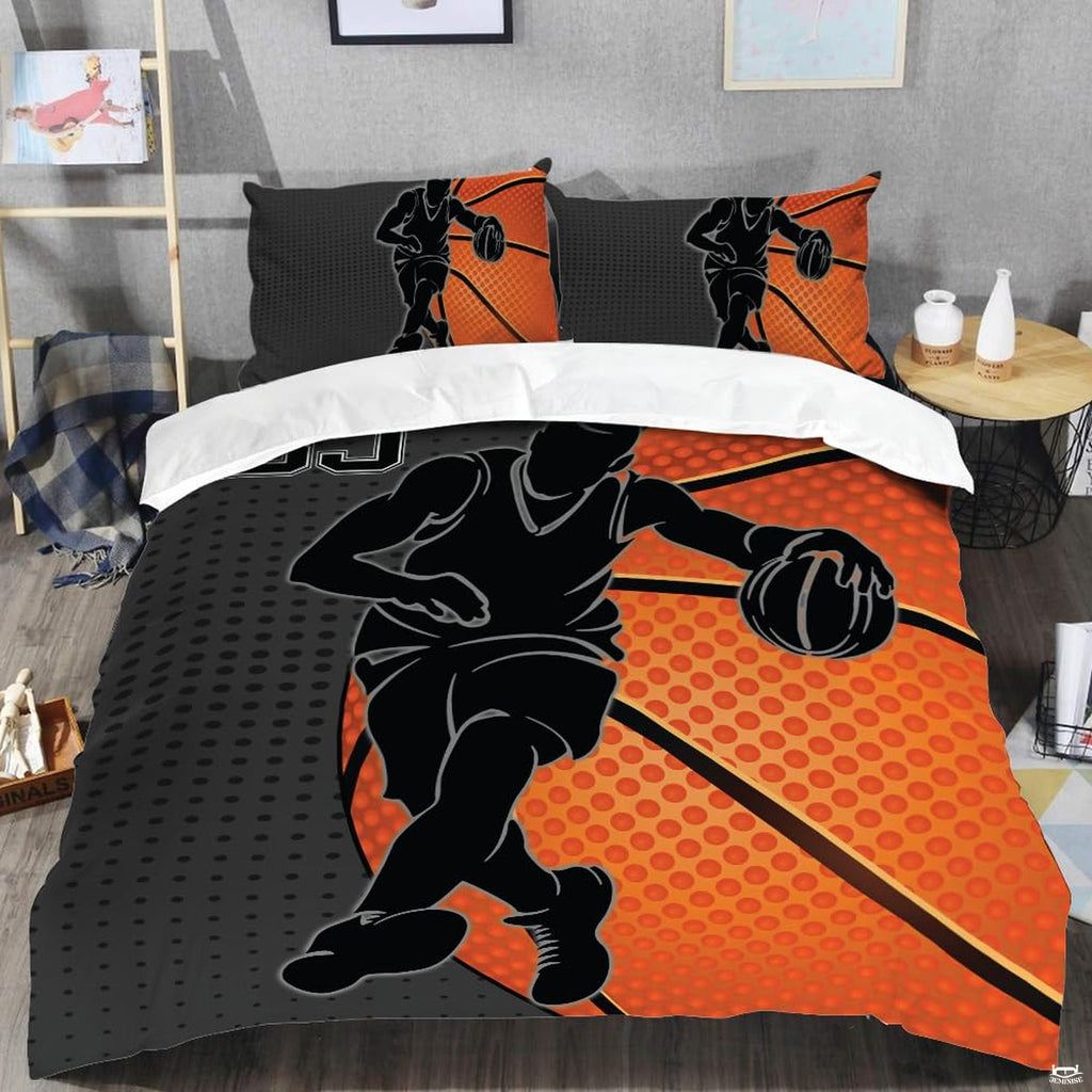 Close-up perspective of sports bedding detailing dimpled orange basketball, black player outline, and halftone dots