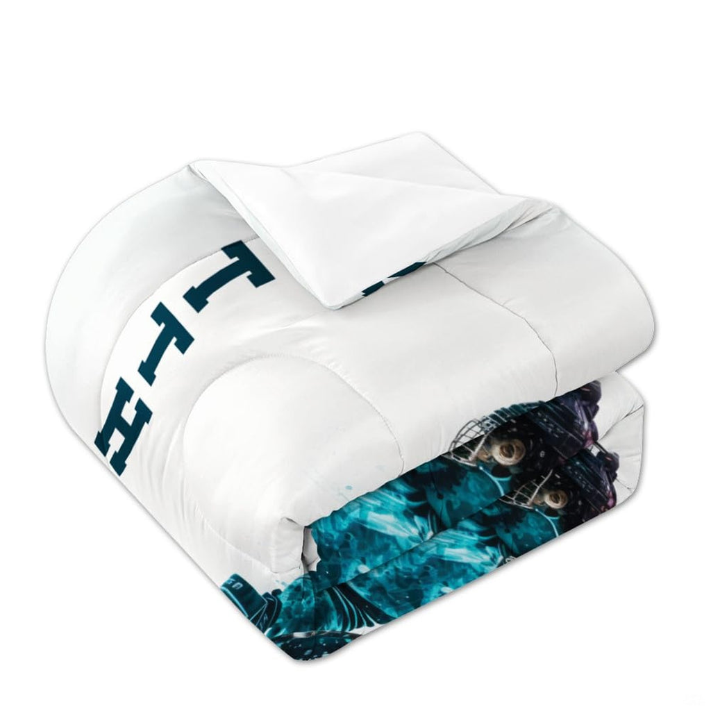 Matching pillowcase detail for hockey bedding set showing coordinating sticks, pucks, and goalie helmet art