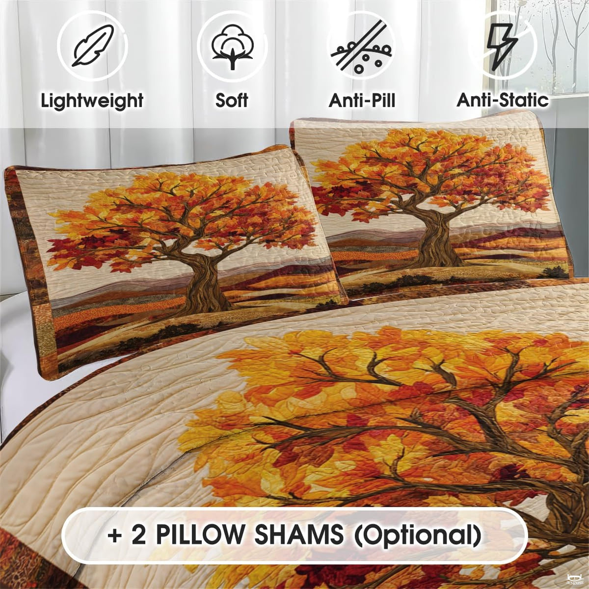 Close-up detail of maple leaf bedding displaying intricate tree artwork, stylized pumpkins, and golden amber accents.