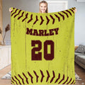 Woman holding distressed fastpitch optic surface blanket in living room