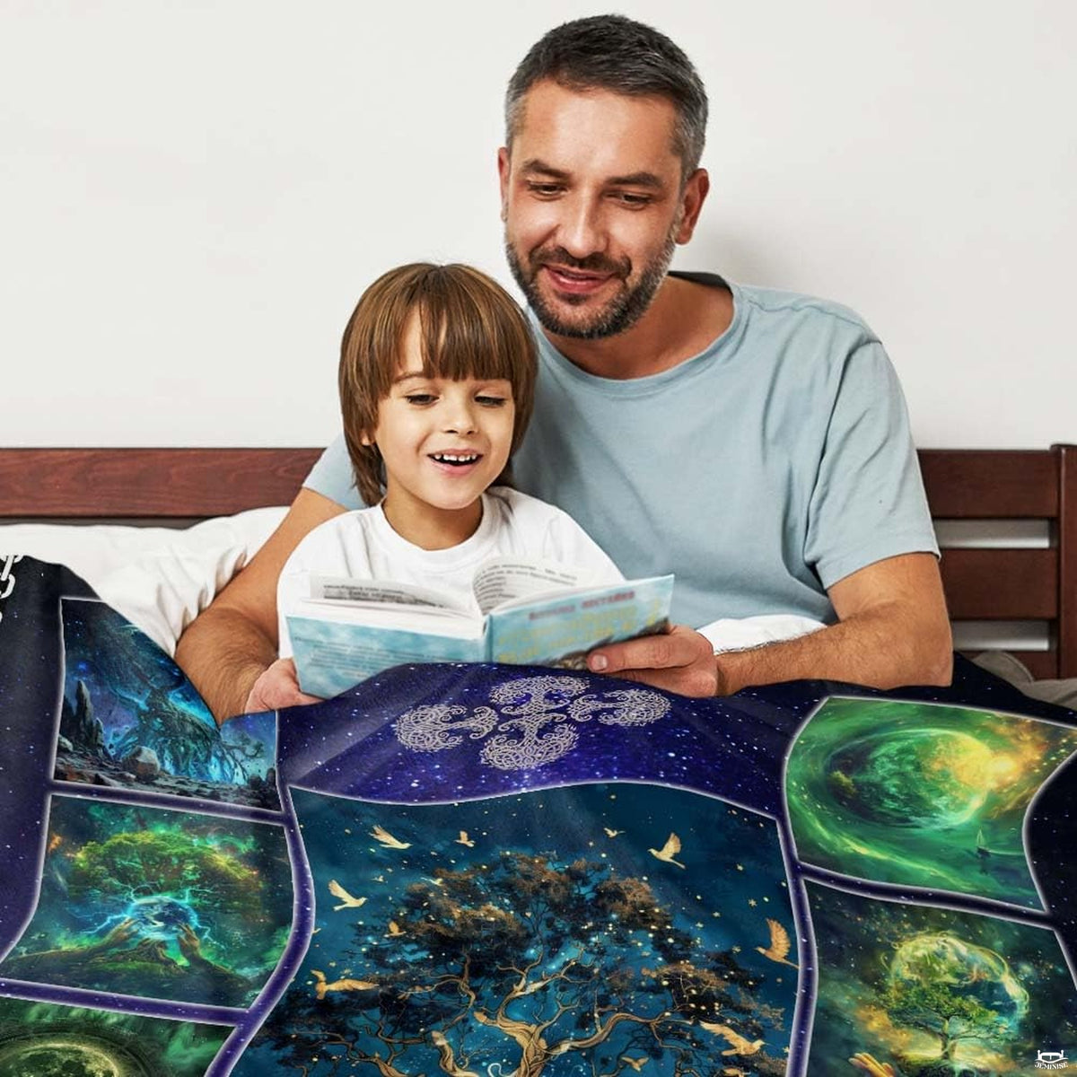 Close-up perspective of illuminated central tree and flying golden birds on celestial throw blanket