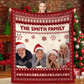 Nordic Fair Isle Christmas family holiday blanket held before festive tree