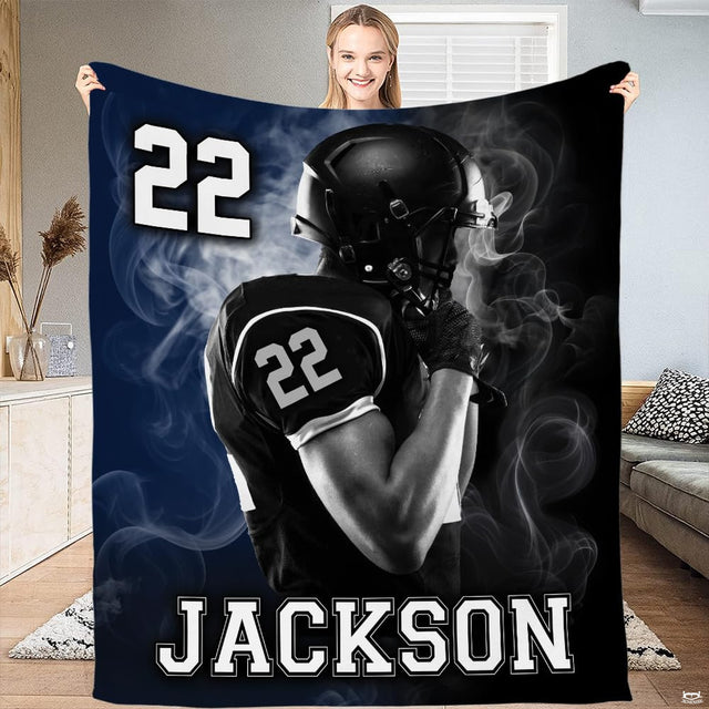Football player smoke plumes throw blanket displaying armored athlete and atmospheric stadium fog