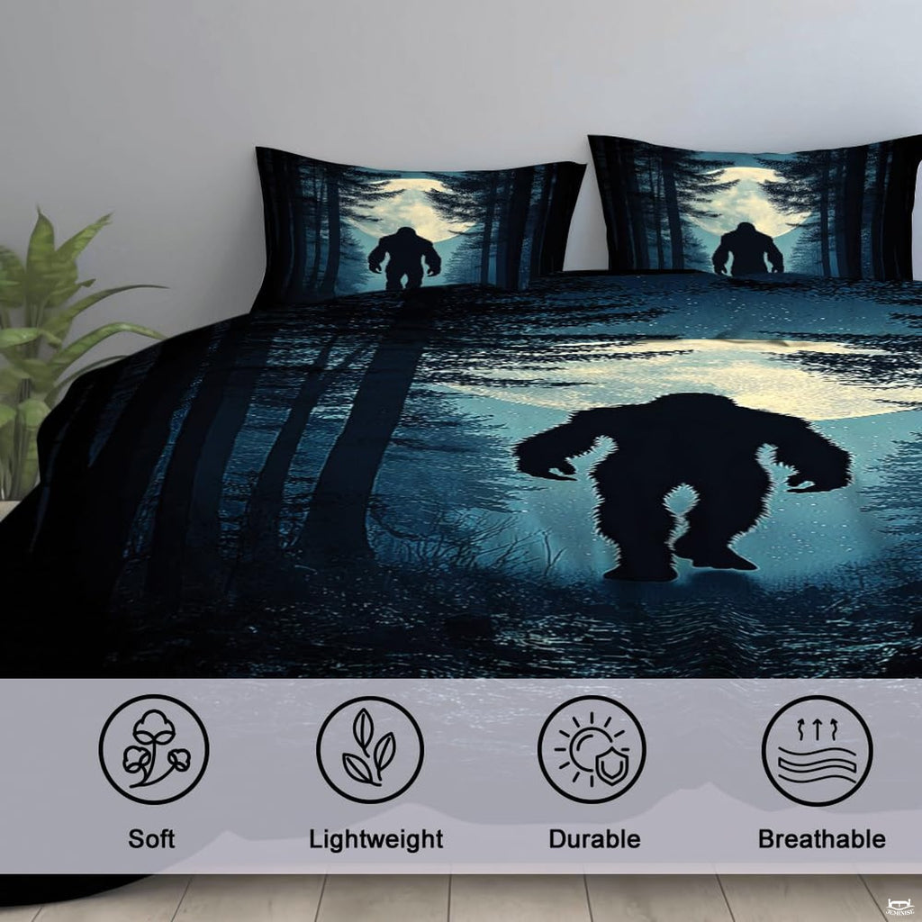 High-angle view of bigfoot graphic bedding showing rich midnight navy, steel blue, and obsidian tones across bed.