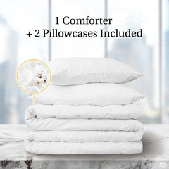 Folded white bedding stack showing included bedding set components.