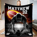 Football center lineman flaming ball throw blanket displaying an athlete over the ball with roaring fire graphics