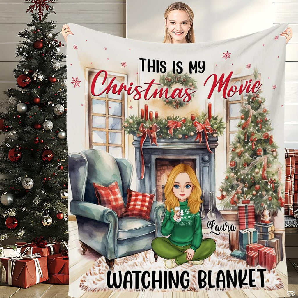 Front view of Christmas movie watching throw blanket held upright showcasing holiday hearth artwork.