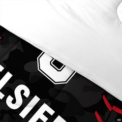 Folded presentation of baseball helmet bedding displaying sharp graphic clarity in raspberry and black tones