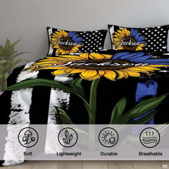Close bedroom view of yellow and blue sunflower artwork with distressed stripes and stars