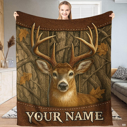 Whitetail buck rustic hunter blanket featuring deer portrait on woodgrain paneling with oak leaves.
