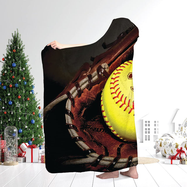 Optic yellow softball resting in brown catcher glove with athletic numerals and script accent, view 2.