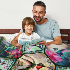 Vibrant hummingbird collage bedding styled neatly on a bed within a bright, contemporary interior space.