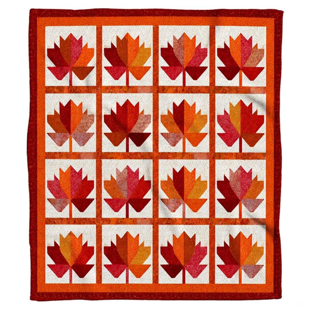 Autumn maple leaf geometric grid throw blanket featuring faceted crimson and amber leaf panels on speckled ivory