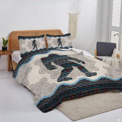 Overhead view of mandala Bigfoot bedding arranged neatly across a bohemian modern bedroom mattress