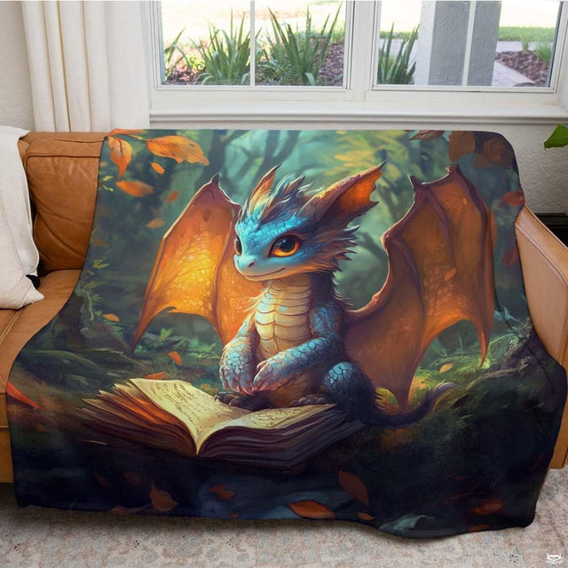 Cute turquoise baby dragon with glowing wings perched on open book in autumn forest, view 2.