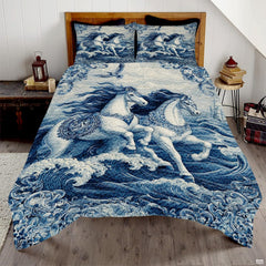 Overhead bedroom view of Delft blue porcelain galloping horses bedding on bed.