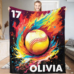 Softball player throwing a ball illustration surrounded by explosive watercolor flames and paint splatters.