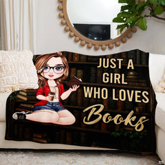 Memorial blanket featuring angel wings and gold sparkles displayed across bedroom bedding.