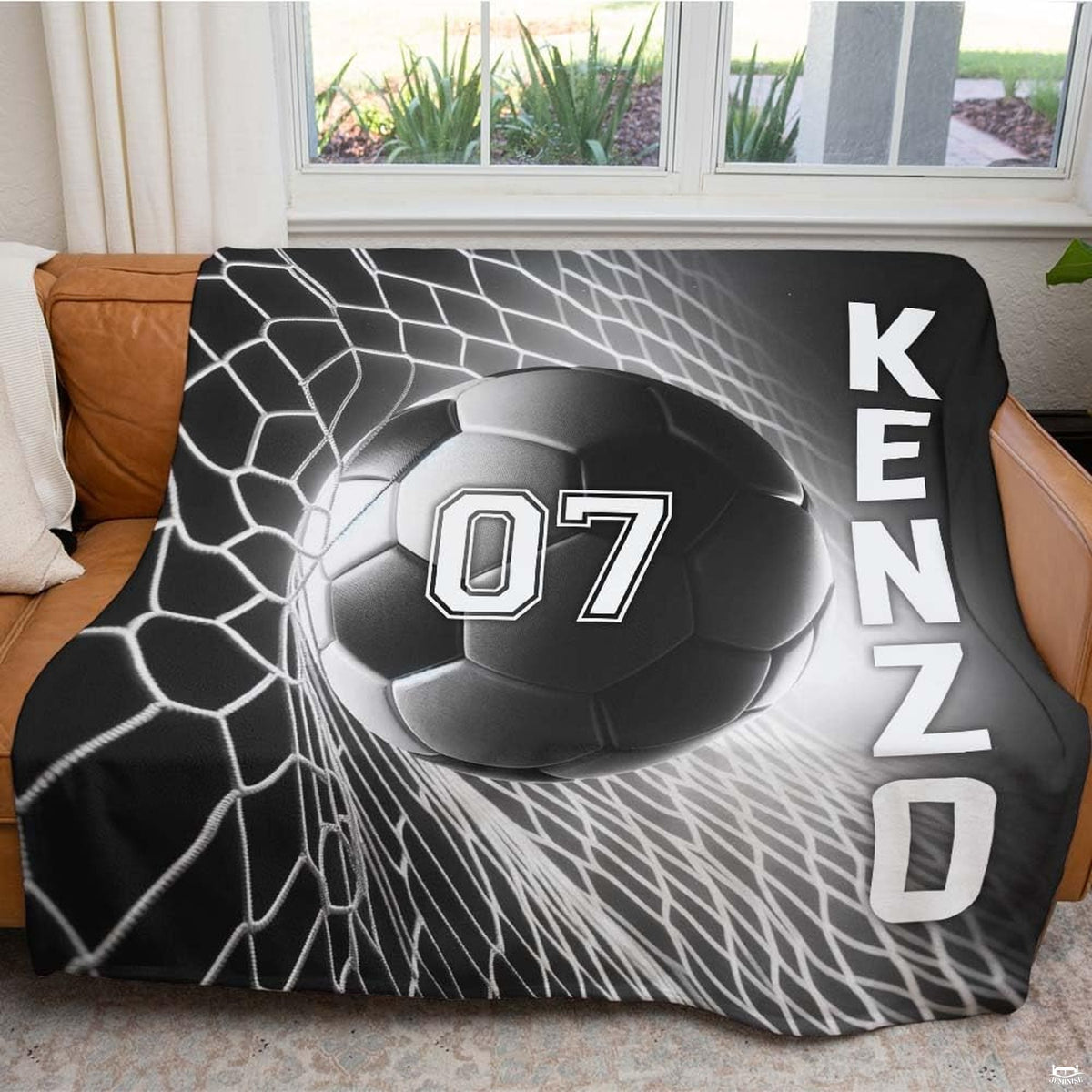 Detailed close perspective of soccer ball stretching goal netting